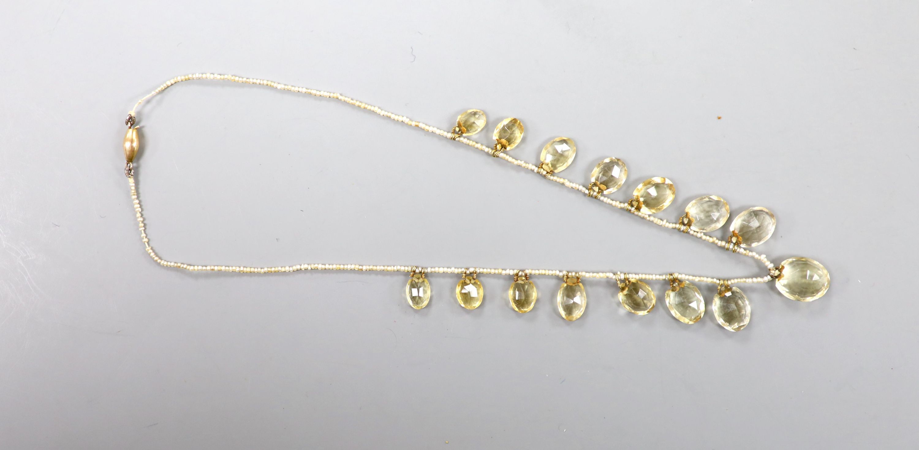 A 19th century citrine and seed pearl set fringe necklace, with yellow metal clasp, 40cm.